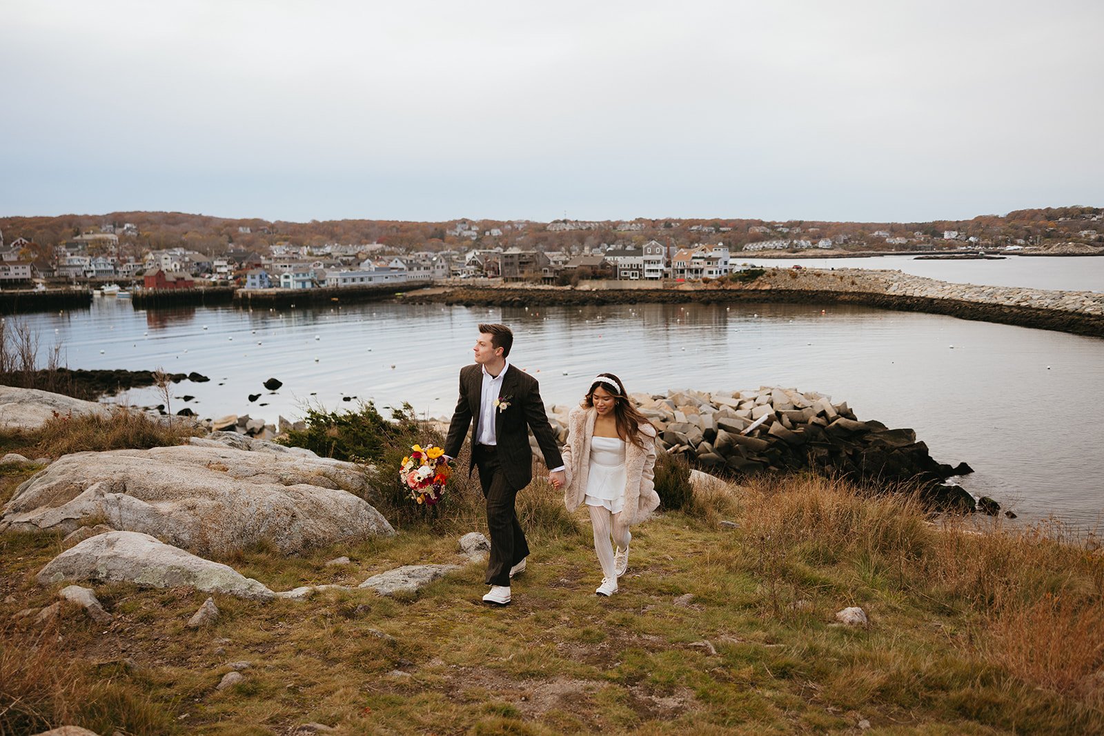 Colorful elopement with red car and balloons in Rockport Massachusetts