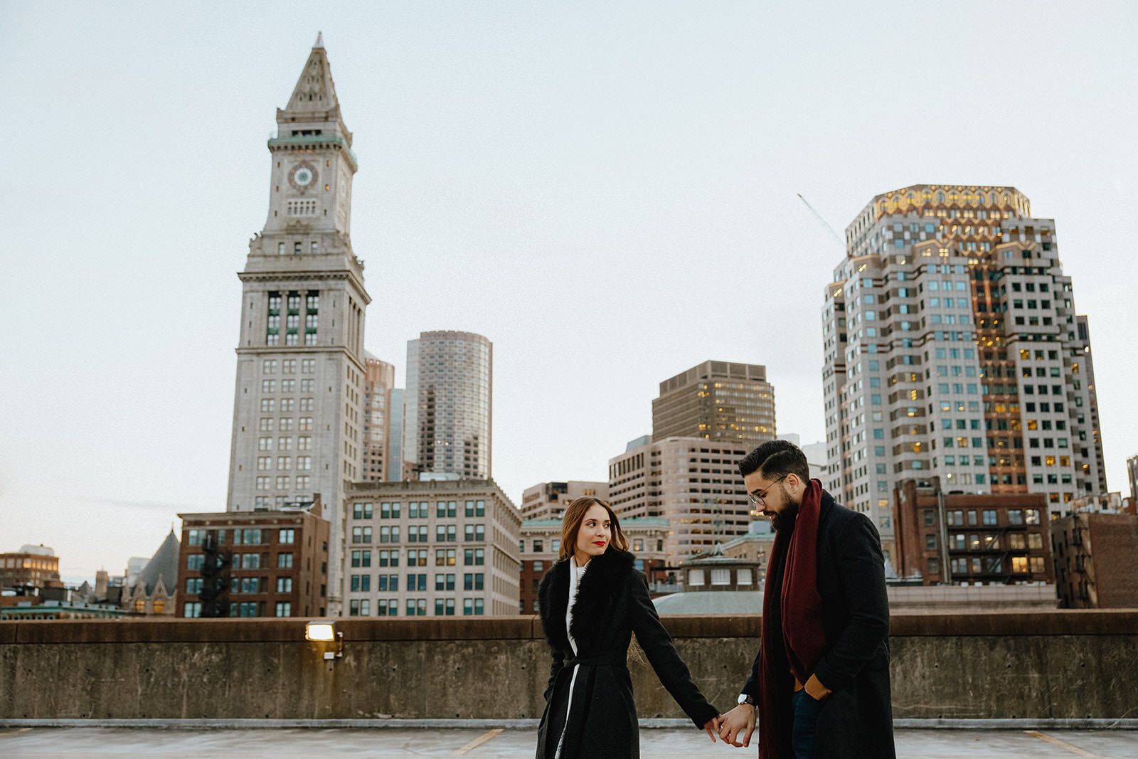 Winter rooftop proposal overlooking downtown boston
