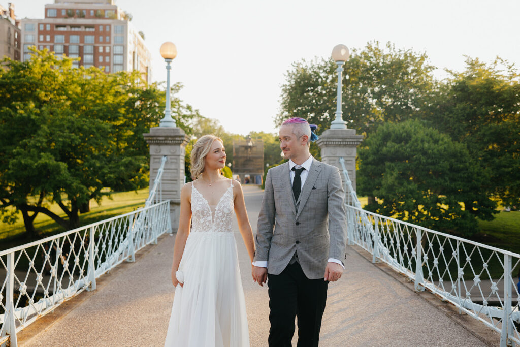 A couple walks along Lagoon Bridge in the Boston Public Garden for the proposal in Boston.