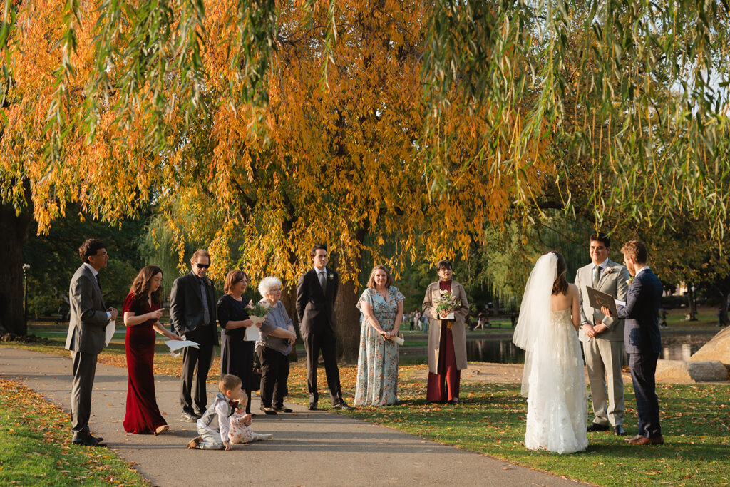 Gabby & Leo elope in a micro wedding with their families in the Boston Public Garden in the New England fall. Shot by Boston elopement photographer.